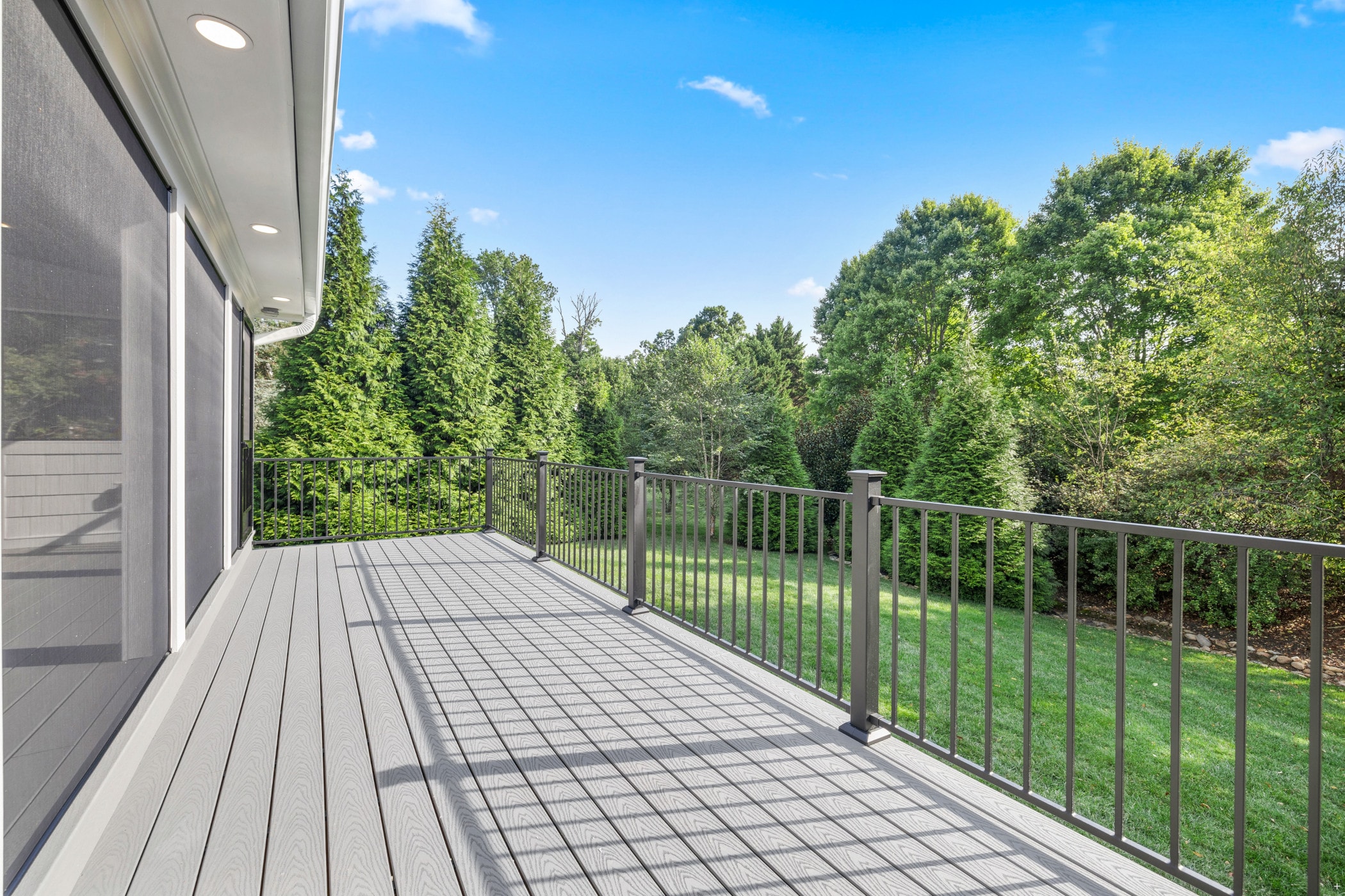 Amberset composite deck with black aluminum baluster railing
