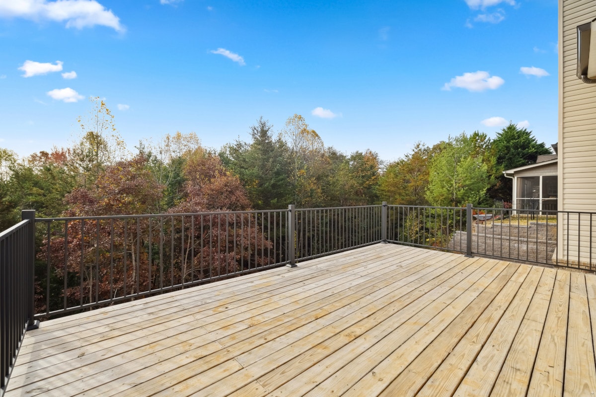 Wood Hollow pressure-treated deck with Fortress FE26 steel railing