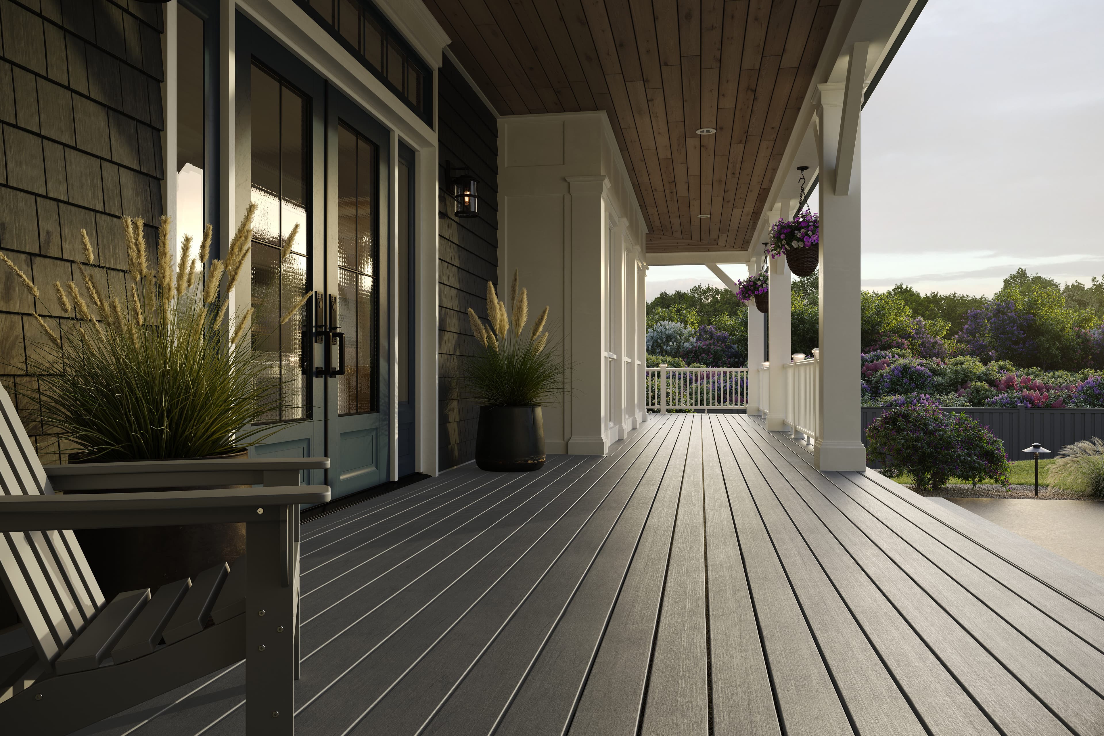 Trex Lineage Island Mist front porch with Adirondack chairs
